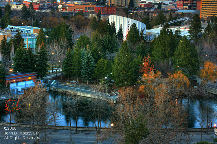 In Spokane's Riverfront Park, daylight transitions into darkness.  