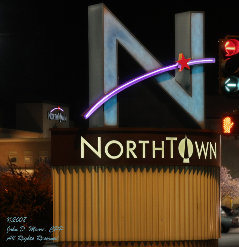 Spokane streetlights pointing the way to Northtown Shopping Center. 